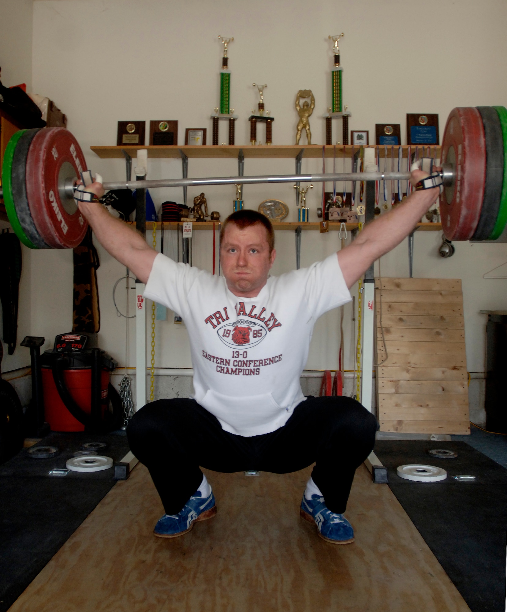 LANGLEY AIR FORCE BASE, Va. -- Staff Sgt. Norman Fulk executes a "Snatch" lift in preparation for the Olympic Trials in Atlanta, May 16 and 17. Previously assigned to the 83rd Communications Squadron, Sergeant Fulk is now assigned to the Air Force World Class Athlete Program, a two-year program that allows him to train for the Olympics. (U.S. Air Force photo/Tech. Sgt. Levi Collins)