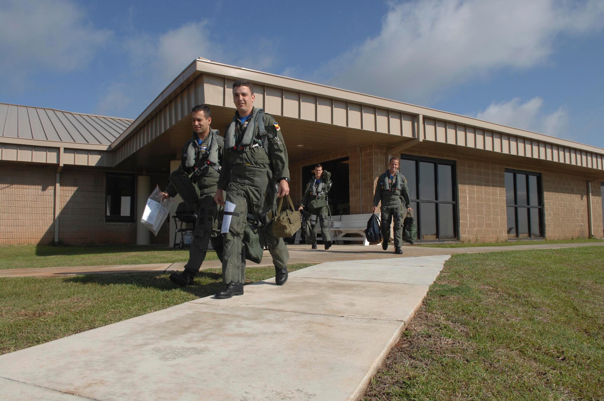 SHAW AIR FORCE BASE, S.C. -- Pilots assigned to the 55th Fighter Squadron step to their F-16's in preparation for take-off in support of Operation Combat Hammer, May 9. Combat Hammer is an exercise evaluation that allows the squadron to be operationally assessed on the effectiveness and suitability of weapons and weapons systems in several different tactical scenarios. (U.S. Air Force photo/Staff Sgt. Nathan Bevier)