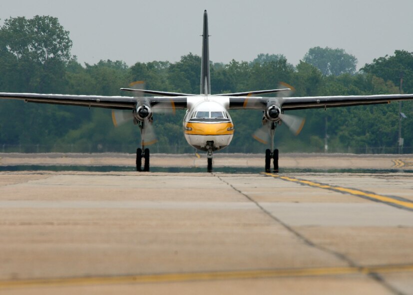 BARKSDALE AFB , La.—The U.S. Army Golden Knights Parachute Demonstration Team aircraft, a C-31 Friendship, taxis out on the flight line here during the Defenders of Liberty Air Show.  The air show commemorates the 75th anniversary of Barksdale Air Force Base. (U.S. Air Force photo by Airman 1st Class Brittany Bateman)