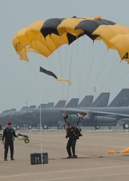 BARKSDALE AFB , La.—A member of the U.S. Army Golden Knights Parachute Demonstration Team lands on the flight line here after a sky dive performance during the Defenders of Liberty Air Show.  The air show commemorates the 75th anniversary of Barksdale Air Force Base. (U.S. Air Force photo by Airman 1st Class Brittany Bateman)
