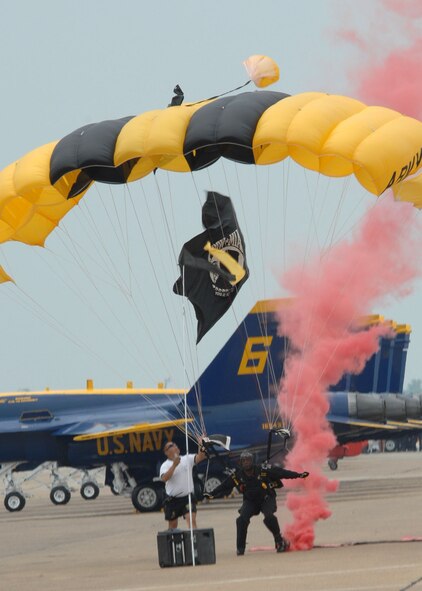 BARKSDALE AFB , La.—A member of the U.S. Army Golden Knights Parachute Demonstration Team lands on the flight line here after a sky dive performance during the Defenders of Liberty Air Show.  The air show commemorates the 75th anniversary of Barksdale Air Force Base. (U.S. Air Force photo by Airman 1st Class Brittany Bateman)