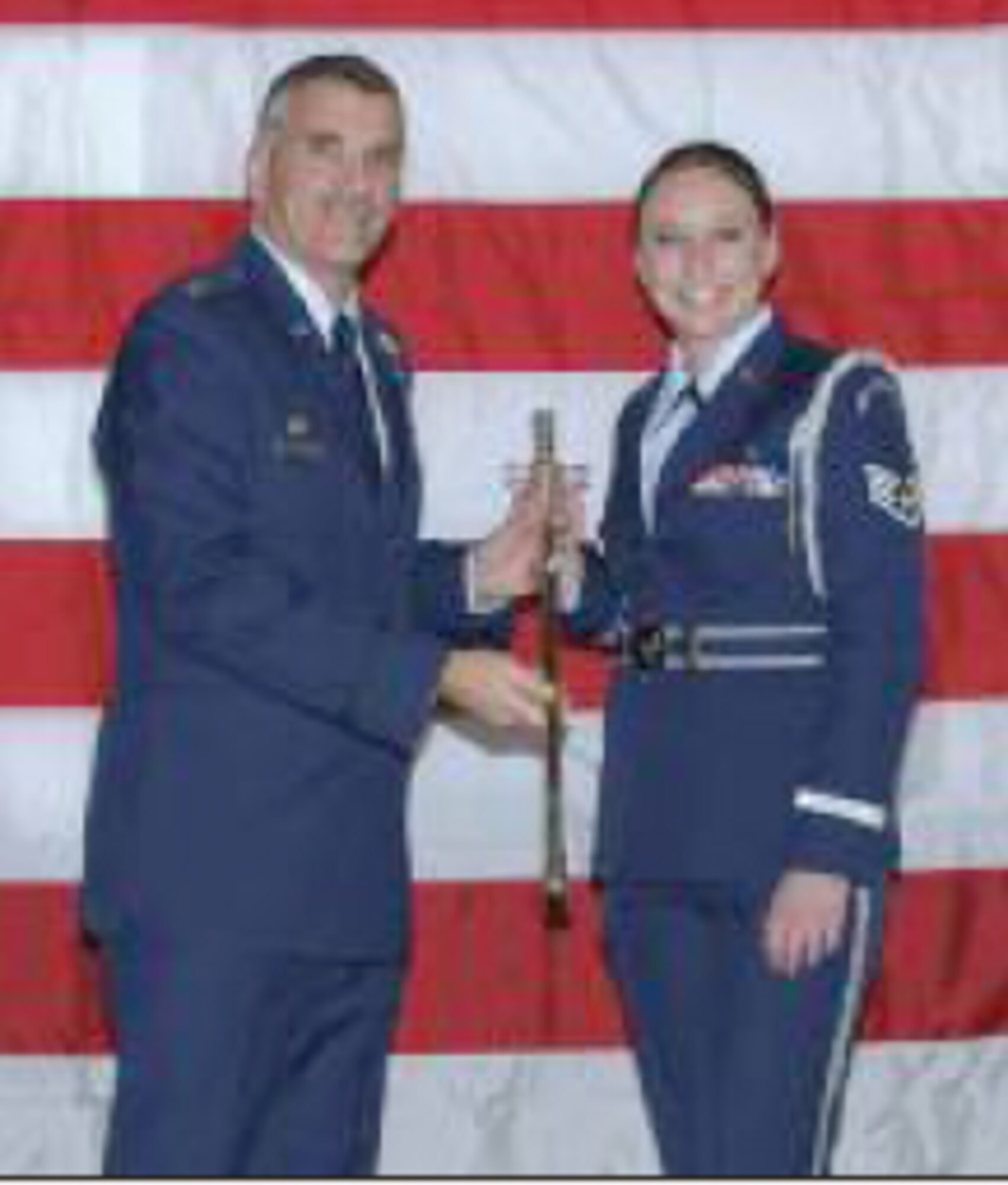 Staff Sgt. Willette is presented the Honor Guard Member of the Year Award by Col. Marcell Kerdavid. Photo: Staff Sgt. Melanie Casineau