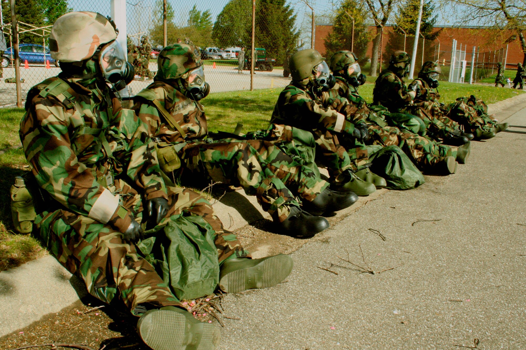 GRISSOM AIR RESERVE BASE, Ind., -- During a recent unit training assembly, Airmen who took part in chemical, biological, radiation and nuclear, or CBRNE, training take a break while waiting for the next portion to begin.  A large number of base personnel were given the training as they prepare for an upcoming operational readiness inspection.  (U.S. Air Force Photo/Tech. Sgt. Patrick Kuminecz)

