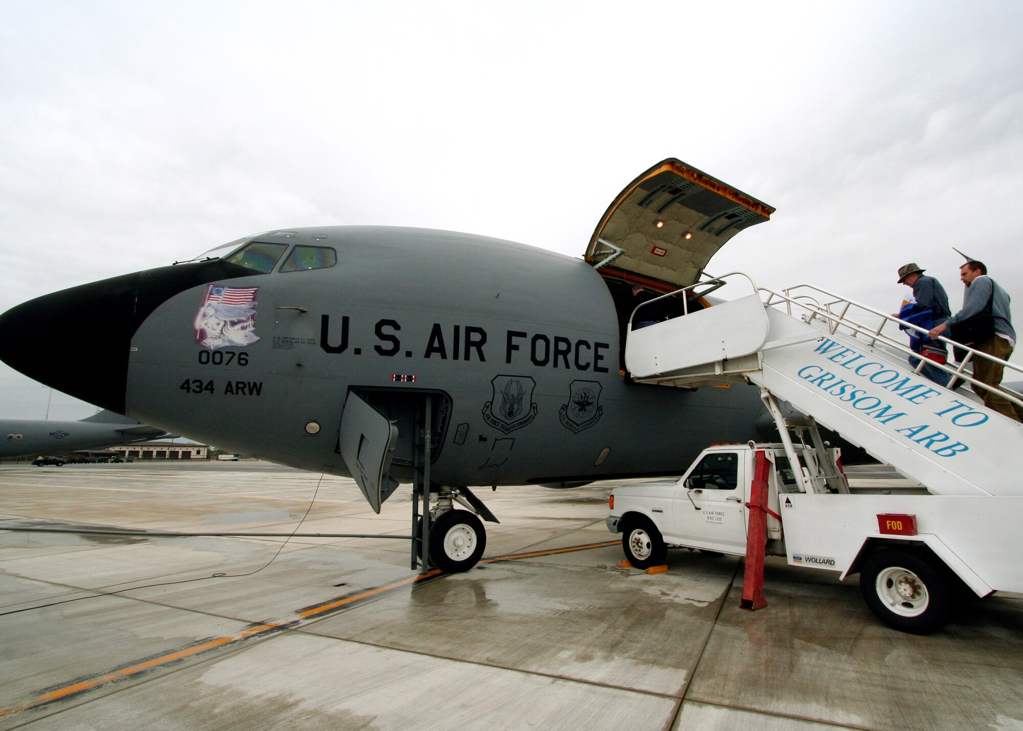 GRISSOM AIR RESERVE BASE, Ind., -- Members of the Peru Tribune climb aboard a Grissom KC-135R Stratotanker as they prepare to witness, and cover, an aerial refueling mission. Media members are periodically invited to visit Grissom and participate in KC-135 flights to enhance their understanding of the 434th ARW's world-wide aerial refueling mission.  (U.S. Air Force photo/Tech. Sgt. Patrick Kuminecz)