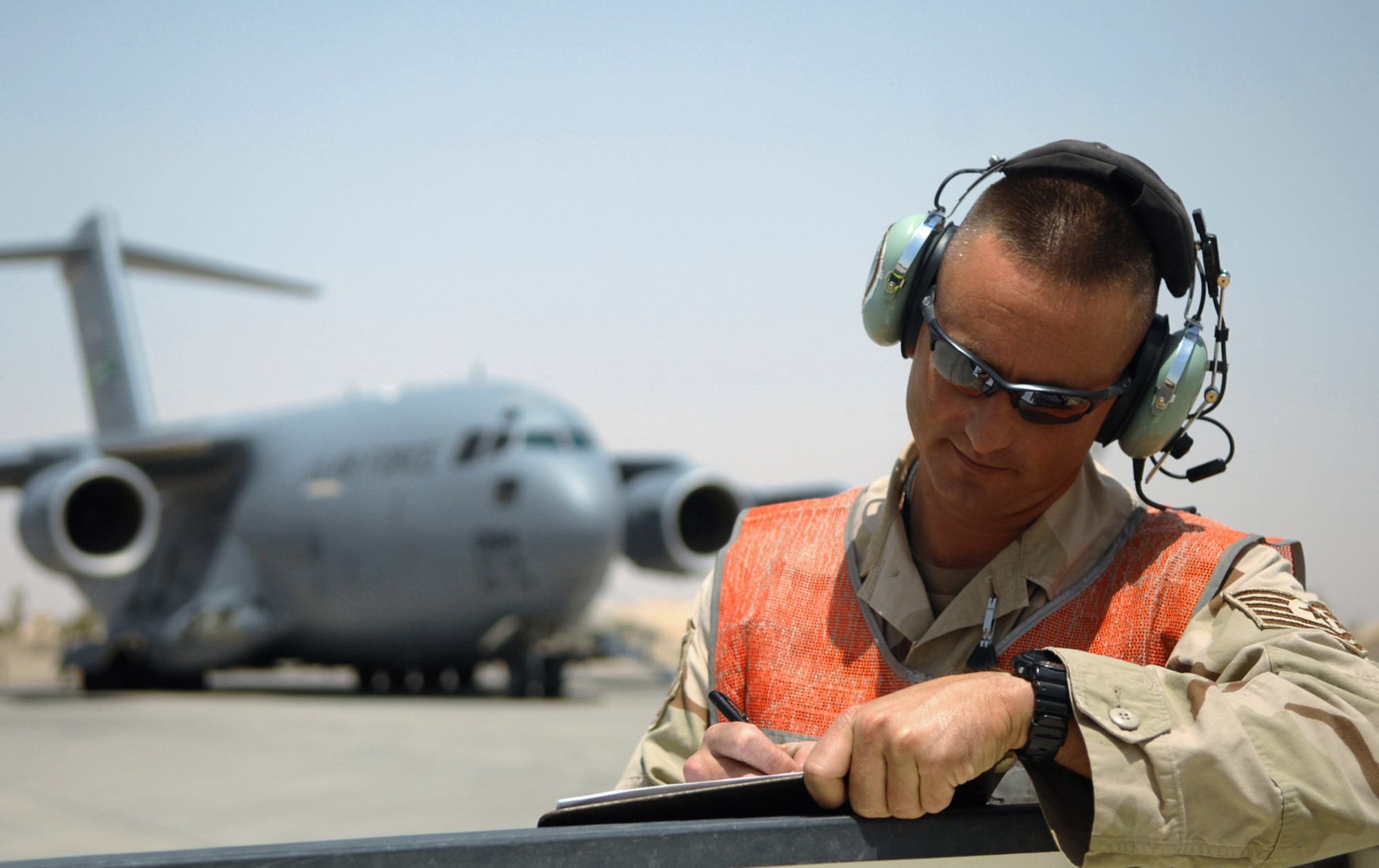 Tech. Sgt. Frank Wisnieski annotates the parking plan of incoming aircraft May 12 at Balad Air Base, Iraq. The Airmen assigned to the transient alert shop are responsible for coordinating aircraft parking positions, fulfilling refueling and maintenance needs, and orchestrating passenger transportation to and from aircraft. Sergeant Wisnieski is a 332nd Expeditionary Maintenance Squadron transient alert supervisor deployed from Ramstein Air Base, Germany. (U.S. Air Force photo/Senior Airman Julianne Showalter) 
