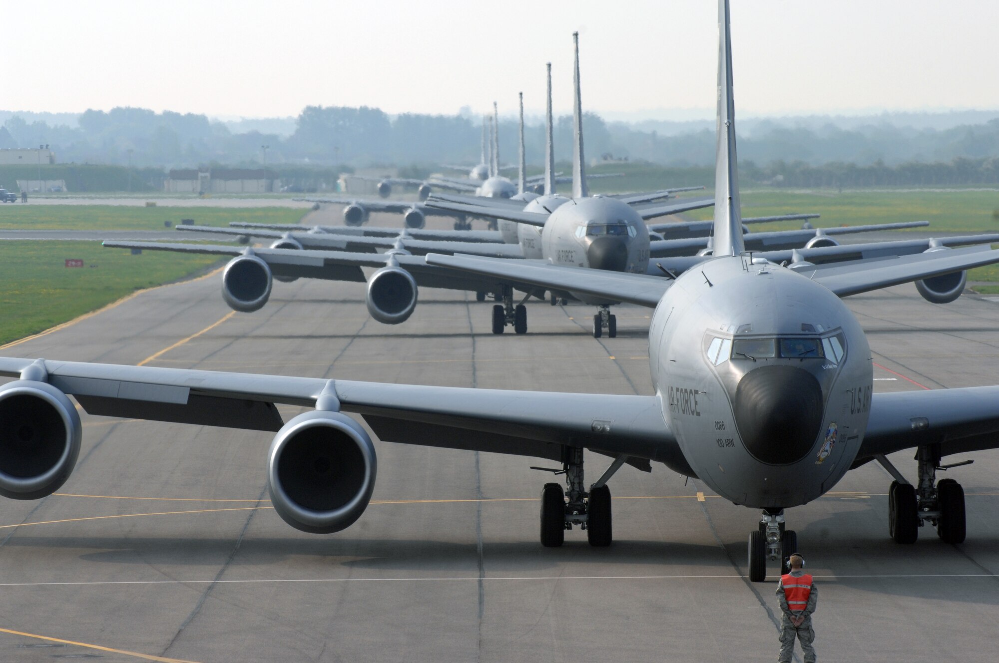Early Friday morning at RAF Mildenhall, England, more than half the fleet of KC-135R Stratotankers assigned to the base performed a massive-rapid response exercise. The event, which involved the launching of eight refueling aircraft, benefitted two parts of the installation’s flying community. Airmen assigned to the maintenance squadrons were able to test their abilities to launch several aircraft simultaneously while the refueling squadrons took advantage of the large number of aircraft in the air by performing formation flights. The last time a large-scale take-off of this kind took place was on March 13, 2006, when seven KC-135R aircraft crews participated. (U.S. Air Force photo by Senior Airman Teresa Hawkins)