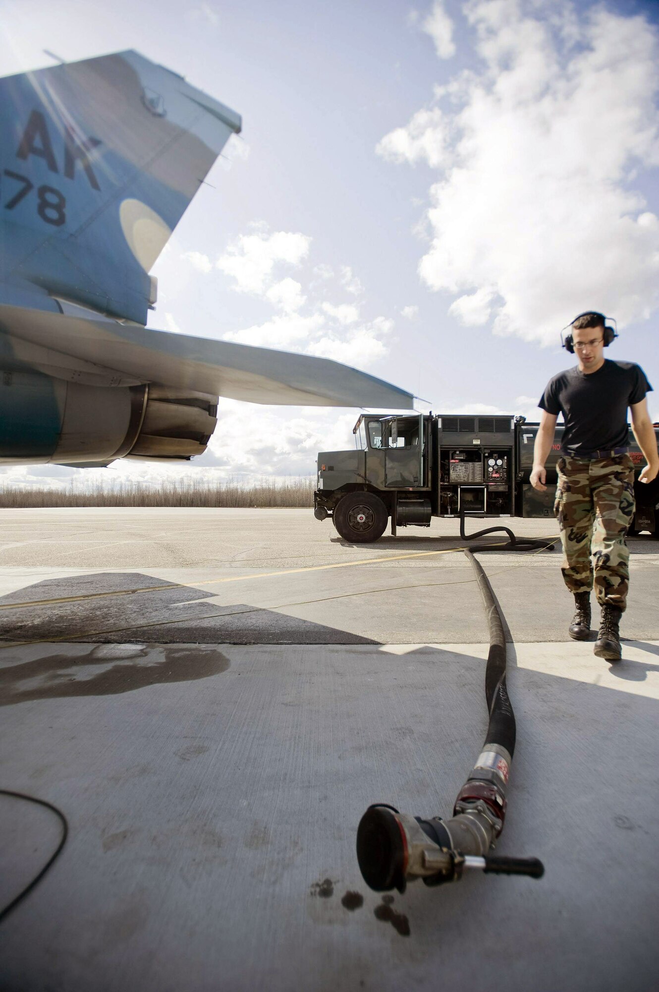 Airman 1st Class Aaron Orr prepares to fuel an F-16 Fighting Falcon May 8 at Eielson Air Force Base, Alaska. The aircraft belongs to the 18th Aggressor Squadron and is participating in Northern Edge 2008, simulating enemy aircraft in order to allow joint forces to train in a realistic environment. Airman Orr is a member of the 374th Logistic Readiness Squadron. (U.S. Air Force photo/Airman 1st Class Jonathan Steffen) 