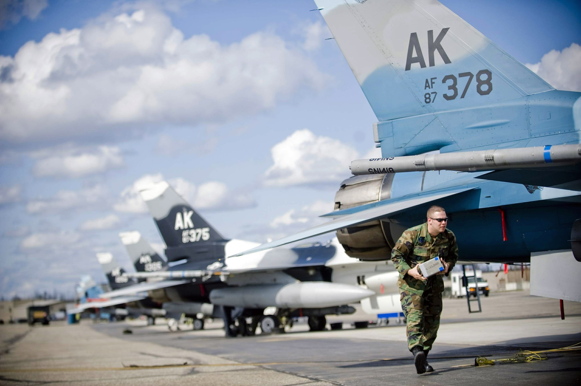 Airman Brad Ivey removes chaff from an 18th Aggressor Squadron F-16 Fighting Falcon May 8 at Eielson Air Force Base, Alaska. The squadron is participating in Northern Edge 2008, simulating enemy aircraft from various countries in order to allow joint forces to train for world wide crises. Airman Ivey is a 354th Aircraft Maintenance Squadron crew chief. (U.S. Air Force photo/Airman 1st Class Jonathan Steffen) 