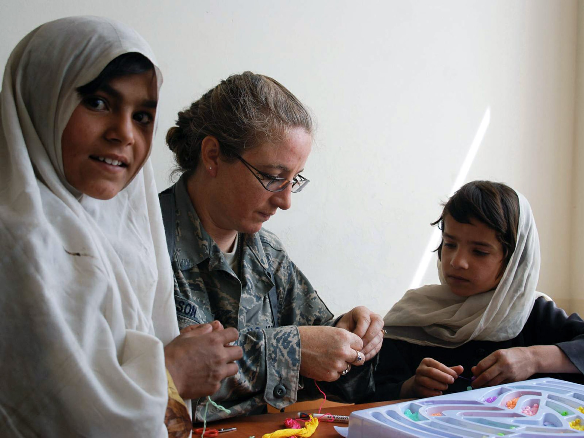 Master Sgt. Billie Wilson takes part in a volunteer community relations program trip to the Zabuli Education Center for Girls and Women May 8 in Kabul, Afghanistan. During the visit to the girls' school, nearly 70 American servicemembers from Camp Eggers delivered backpacks, toys and school supplies to the students. Sergeant Wilson is assigned to the of Command Securities Transition Command-Afghanistan. (U.S. Navy photo)

