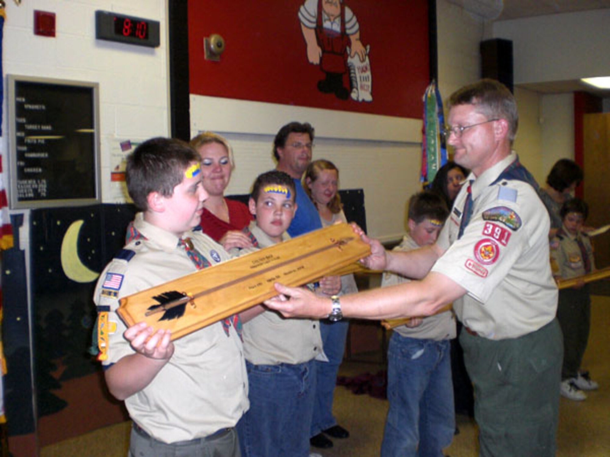 Pack 391 Cubmaster David Liszeski presents the Arrow of Light award to one of the members of his Pack during a recent meeting.  Lisenski was recently rescognized as the District Cubmaster of the Year by the Boy Scouts Will Rogers District. As an Air Force Reservists SMSgt. David Liszenski works for the 507th Civil Engineer Squadron, 507th Air Refueling Wing.
