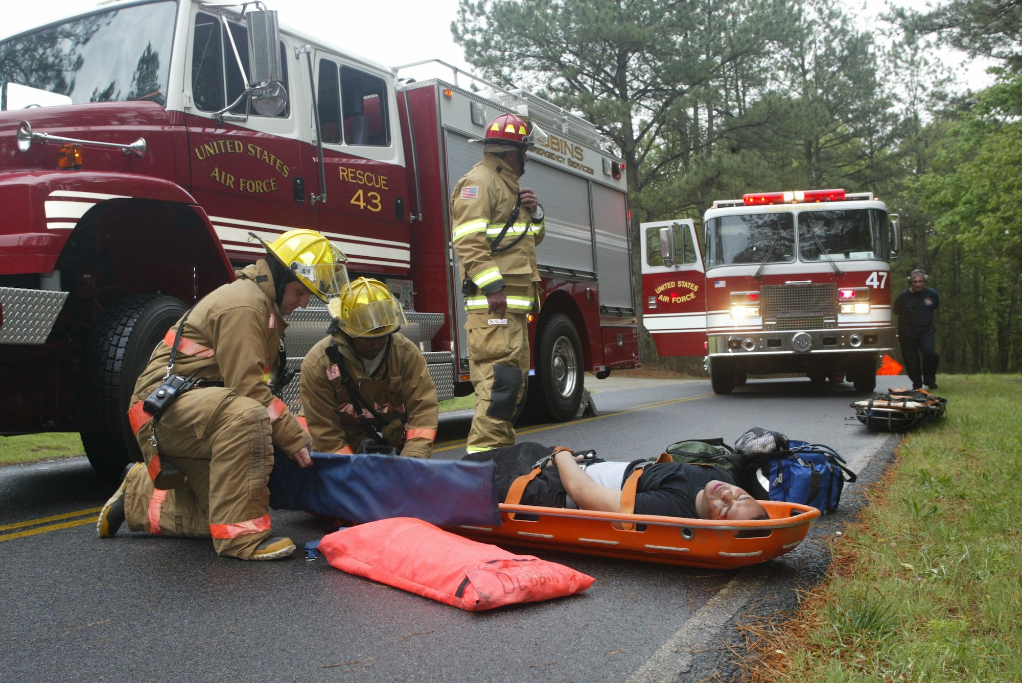 DOBBINS AIR RESERVE BASE, Ga., -- On May 3, Dobbins Air Reserve Base Fire Department escue personnel performed life saving procedures on an accident victim after being removed from a crash scene during a similated vehicle accident excercise scenerio. The exercise was one of several that the wing have performed to get ready for the upcoming Unit Compliance Inspection and Operational Readiness Exercise. (Air Force photo/Don Peek)