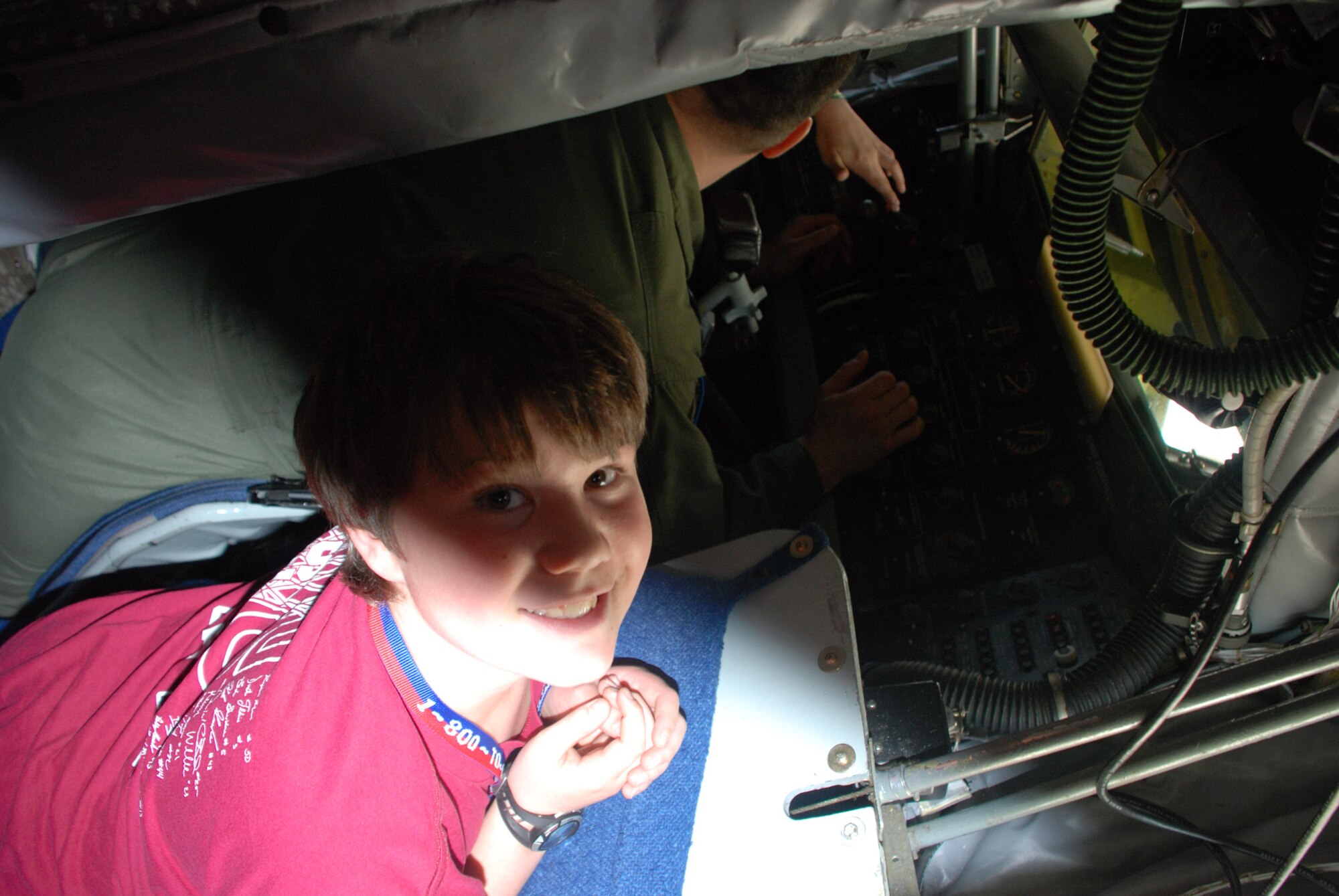 Nick Albrecht, 11, son of Tech Sgt. Robert Albrecht, 107th Airlift Wing, hangs out in the boom pod, of a KC-135R while 107th Airlift Wing boomer, Master Sgt. Raymond Fitzpatrick, describes his job.  Nick is attending a tour of the 107th?s aircraft during bring your kids to work day April 24.  
