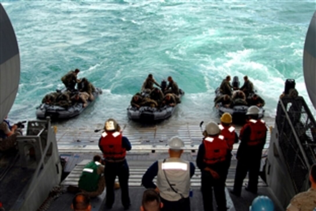 U.S. Marines prepare to disembark the USS Iwo Jima on a combat rubber reconnaissance craft, May 12, 2008. The Iwo Jima and the 26th Marine Expeditionary Unit's 2nd Recon Battalion are participating in the Iwo Jima Expeditionary Strike Group integration exercise. 