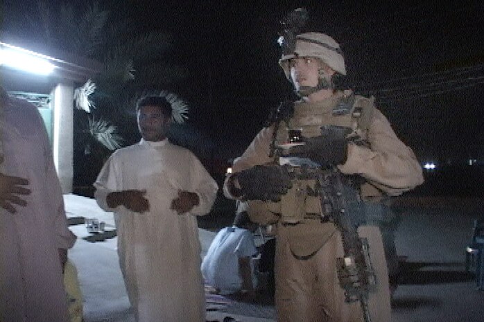 Sgt. Dennis K. Derr II (left), Section A leader, Mobile Assault Platoon, Weapons Company, 3rd Battalion, 6th Marine Regiment, Regimental Combat Team-1, stops during a night patrol to have a cup of chai tea with the locals here May 13. â??A lot of times youâ??ll find Iraqis are very hospitable,â? Derr said. â??They always want to give you something to eat, something to smoke and something to drink. Instead of me disrespecting them by pushing on, I said Iâ??d stay and have one quick glass with them. It keeps a good relationship between each other. I respect them, they respect me. It makes our life a lot easier around here. â?