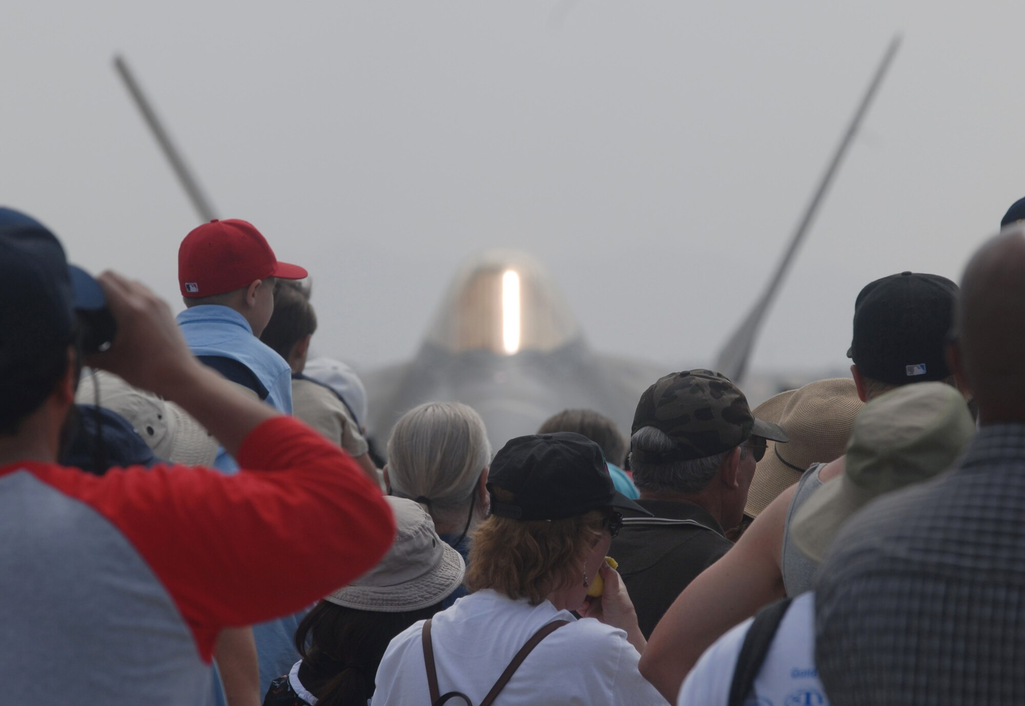 The crowd gathers in front of an Air Force F-22 Raptor fighter aircraft, from the 43rd Fighter Squadron, Tyndall Air Force Base, Fla., during AirFest '08 at March Air Reserve Base, Calif. The May 3-4 air show, called "Thunder Over the Empire," attracted about 400,000 visitors to the base. It coincides with the 90th anniversary of March as a military base and the 60th anniversary of the Air Force Reserve.(U.S. Air Force photo by Val  Gempis) 