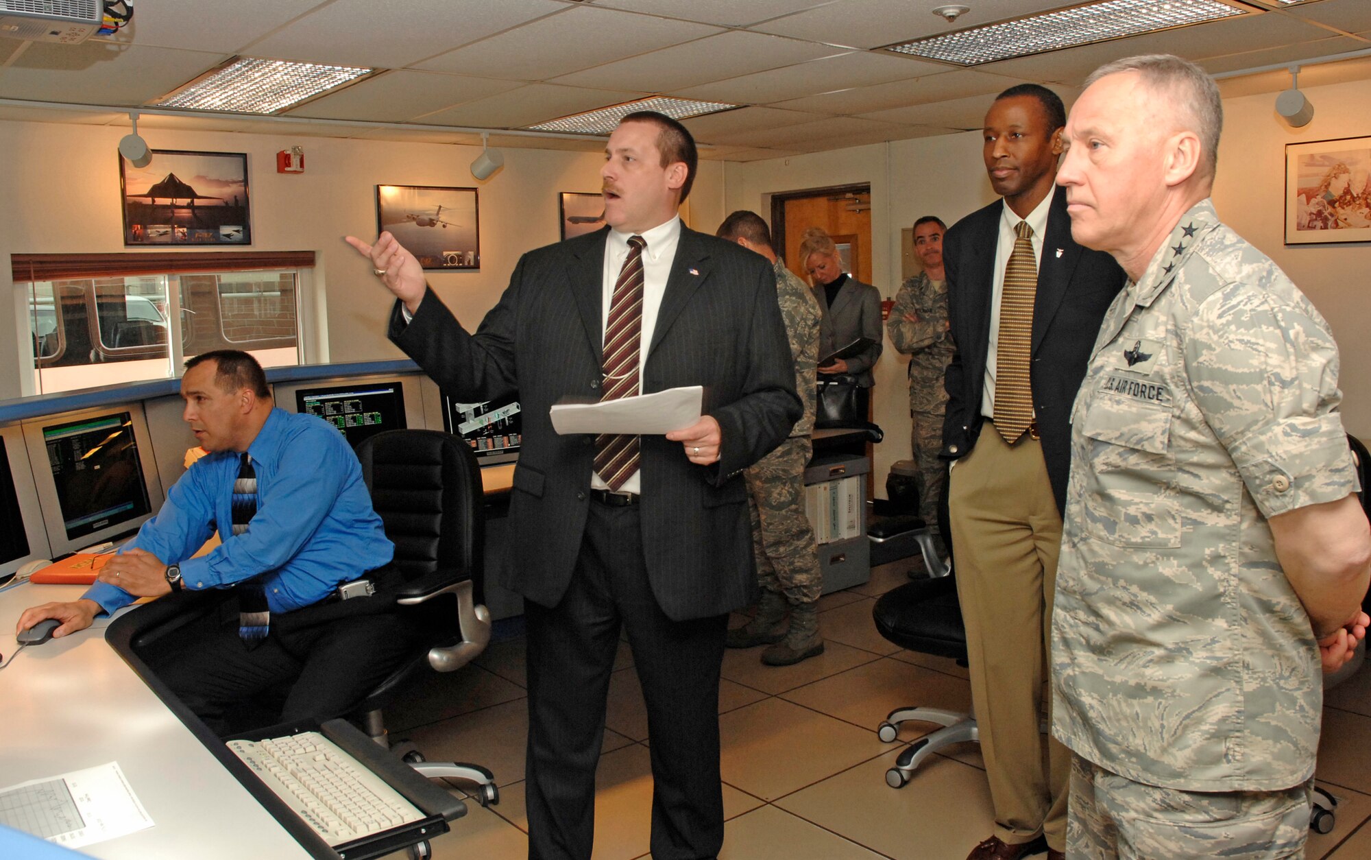 Dave Perkins, 88th Air Base Wing acting Base Civil Engineer, and Dave Burkholder, maintenance engineering chief, 88th ABW Civil Engineer Directorate, brief Gen Bruce Carlson, Air Force Materiel Command commander, and Timothy Bridges, AFMC's director of Installations and Mission Support, on status of infrastructure across Wright-Patterson Air Force Base.  General Carlson toured base facilities and observed wing people and mission support in action on May 8. (U.S. Air Force photo/Al Bright)  