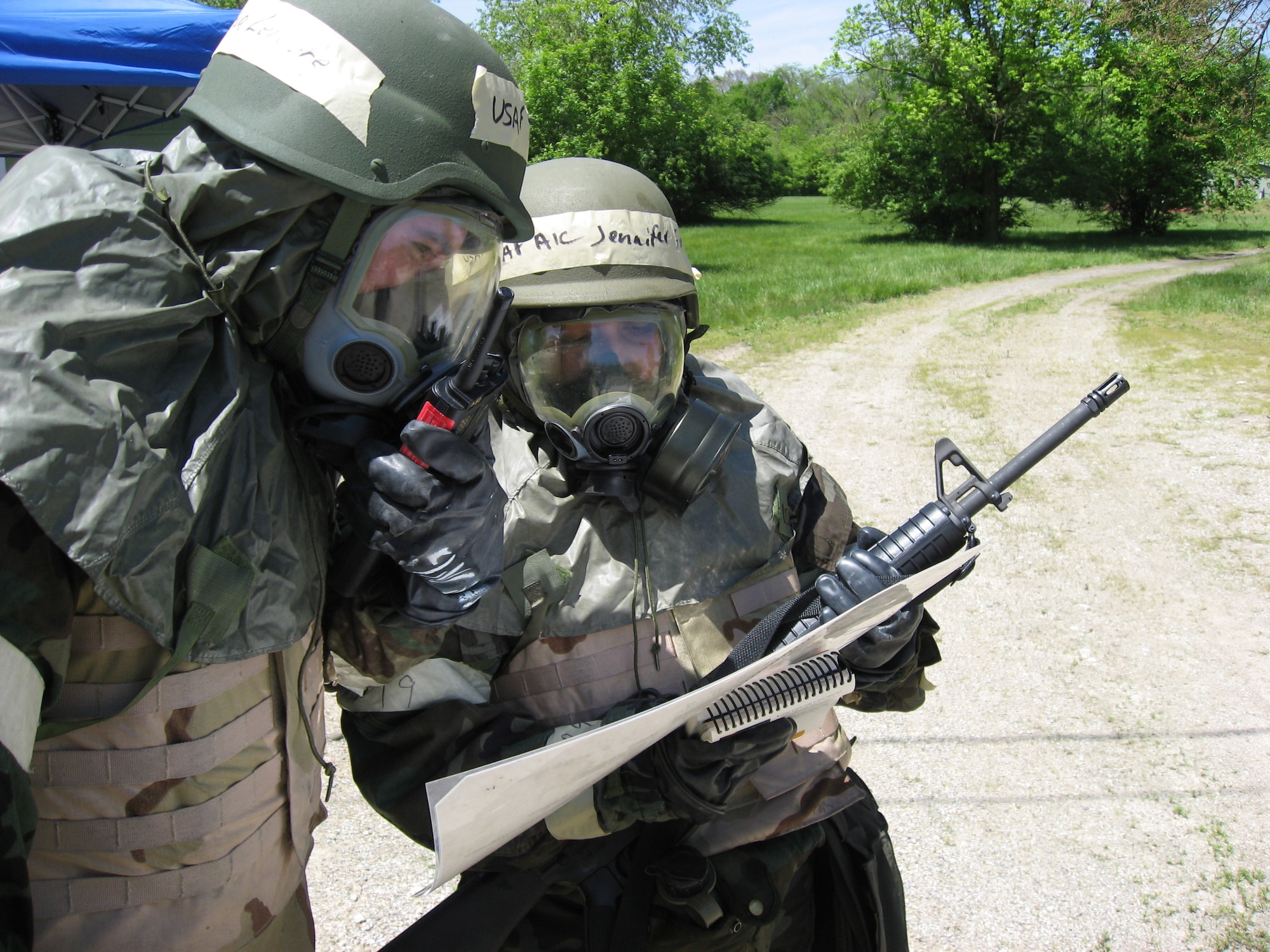 Airmen First Class Joshua Lefevre and Jennifer Fuentes, both members of the 88th Medical Support Squadron at Wright-Patterson Air Force Base, Ohio, perform a post-attack damage assessment and security sweep following a simulated attack.  The Airmen were participating in an employment exercise here May 13, part of the base preparations for an Operational Readiness Inspection. Wright-Patterson Medical Center Airmen frequently deploy in support of Operations Iraqi Freedom, Enduring Freedom and global humanitarian response missons.  (U.S. Air Force photo/Derek Kaufman) 