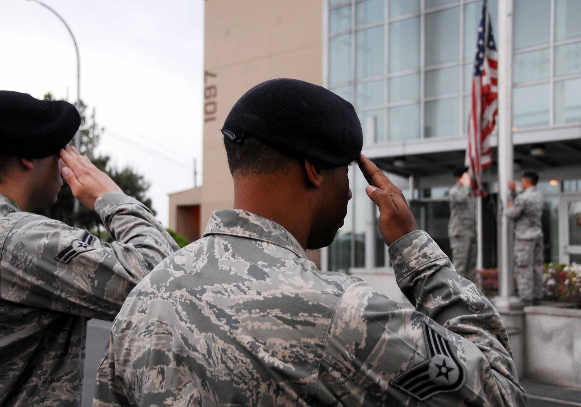 OSAN AIR BASE, Republic of Korea – Members of the 51st Fighter Wing Security Forces Squadron pay respect to the flag and fallen police men and women during reveille May 13. As part of National Police Week, May 11-16, the 51st SFS honored the memory of fallen U.S. police officers, both civilian and military. The also hosted events demonstrating the squadron’s capabilities. (U.S. Air Force photo/Senior Airman Christopher Boitz)