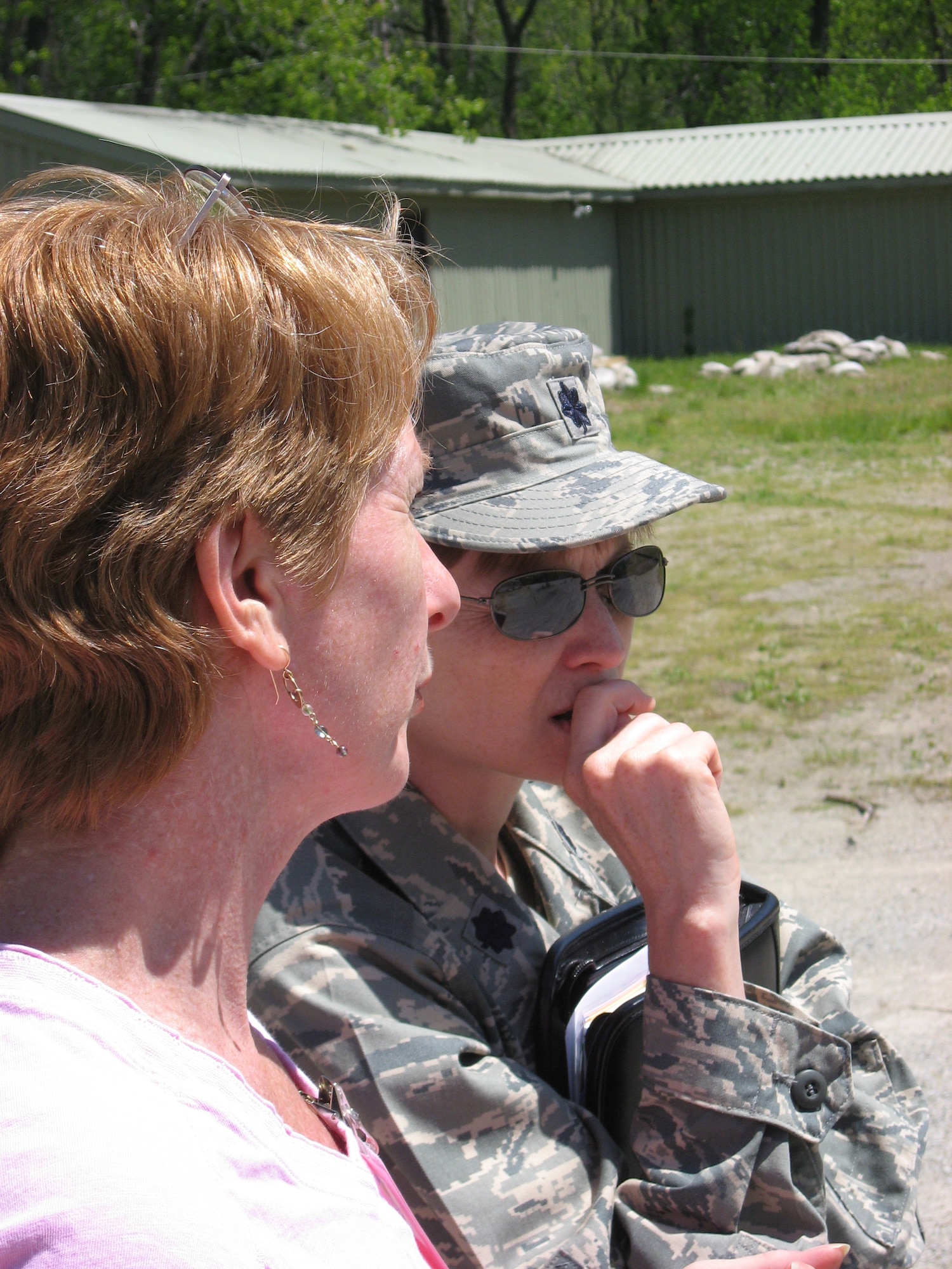 Carmen Riches, exercise program manager, 88th Air Base Wing Installation Exercise Program Office, and Lt. Col. Wendy Larson, 88th Air Base Wing chief of plans and programs, observe response by Wright-Patterson Air Force Base Airmen to a simulated chemical attack during an exercise here May 13. (U.S. Air Force photo/Derek Kaufman)
