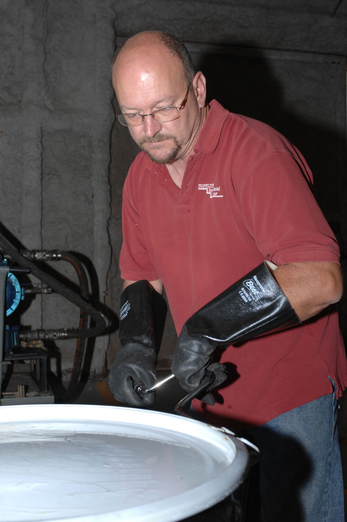 Dyess AFB, Texas- Brian Rose, environmental technician, seals a drum, May 14. Once the waste is unloaded from the drum, they are returned to the location that they were picked up from for use again. (U.S. Air Force photo by Courtney Richardson)