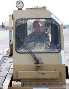 Airman 1st Class Adam Bourquin loads cargo onto a C-17 Globemaster. (courtesy photo)
