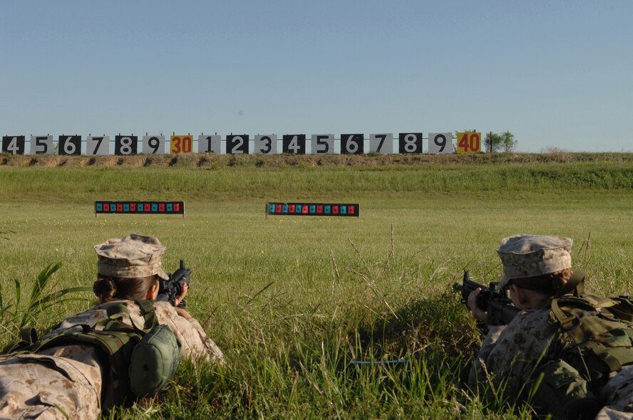 MINERAL WELLS, Texas -- Lance Cpl. Brandy Rivers (left) and Lance Cpl. Elizabeth Kersey shoot their BZO targets May 9, 2008. Det. 1 spends an entire weekend out at the range to qualify with their M-16s and some get the privilege of shooting the 9mm. Marines are rewarded with medals for qualifing with the M-16 and ribbons with the 9 mm. (U.S Air Force photo by Airman 1st Class Jennifer Romig)