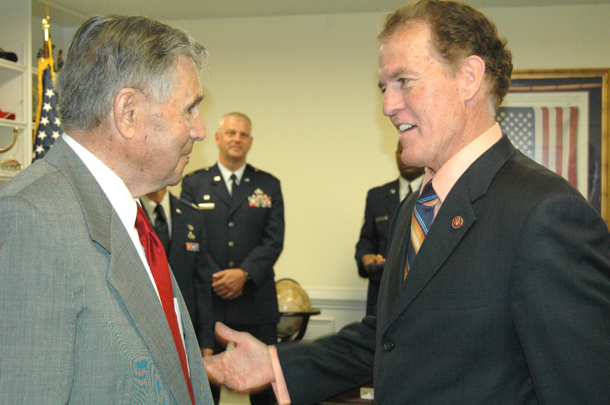 DOBBINS AIR RESERVE BASE, Ga., -- Maj. Peter Wojihowski, Lt. Col. Michael Miralles, Master Sgt. Carl Vandiver and Master Sgt. Raymond Beyers all members of the 94th Airlift Wing, were on hand May 9 when Congressman Phil Gingrey presented veteran Staff Sgt. John Scuiletti with an Air Medal,  Good Conduct Medal and an Asiatic Pacific Campaign Medal. All were belated. The presentation took place at Congressman Gingrey's Marietta office. Sergeant Scuiletti said he was honored to have military members present. Sergeant Scuiletti is 90 years old and resides in Paulding County. (Air Force photo/Micah Garbarino)