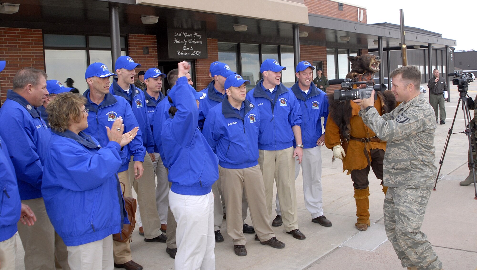 Members of Malmstrom's Guardian Challenge team are filmed upon their arrival at Peterson Air Force Base, Colo., May 7. (U.S. Air Force photo/Dennis Howk)