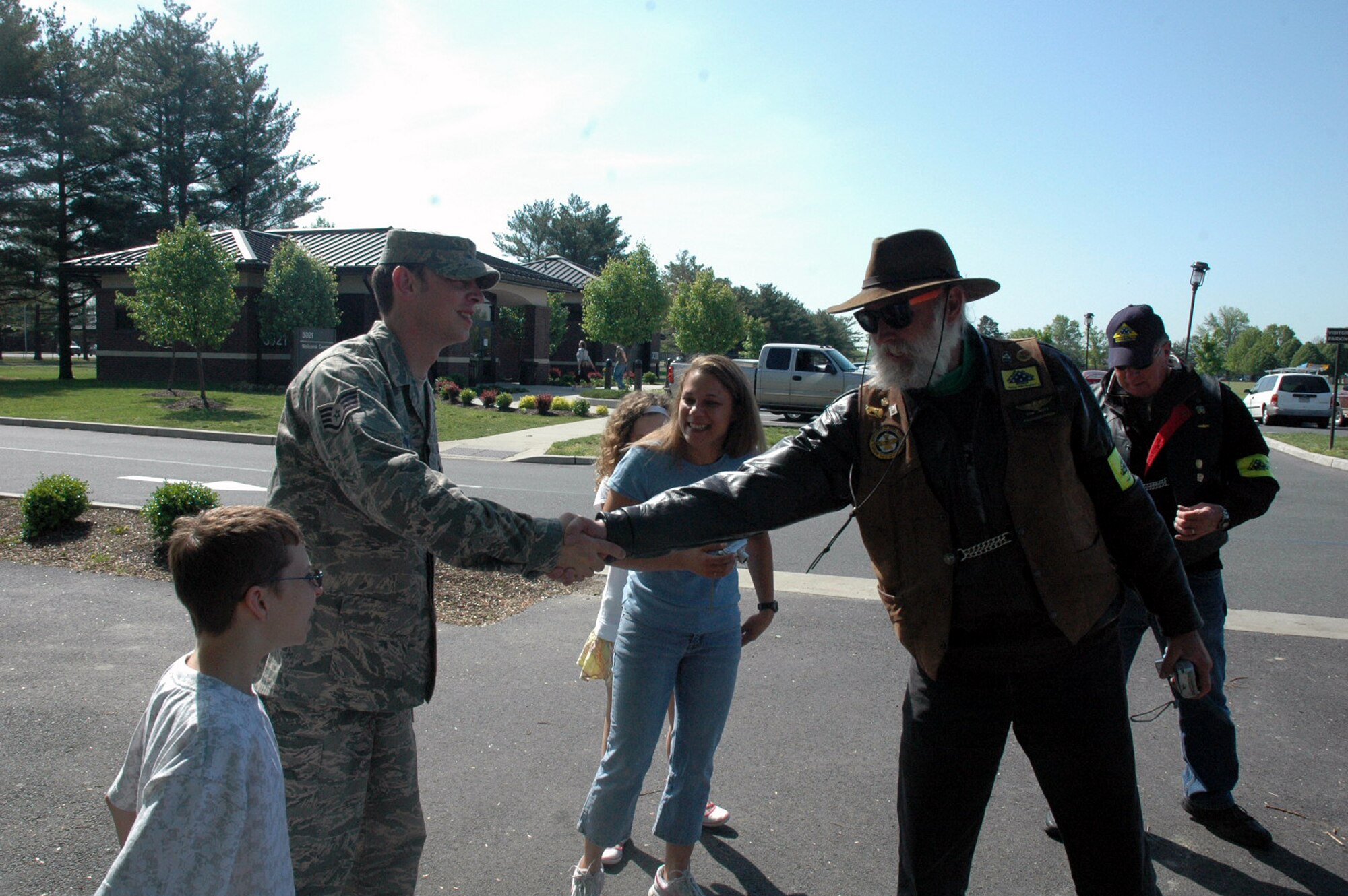 Staff Sgt. Peter Bundesen shakes hands with a member of the Patriot Guard Riders who escorted him home from the Philadelphia Airport to McGuire Air Force Base, N.J., May 14, 2008.  Sergeant Bundesen, from McGuire's 305th Aircraft Maintenance Squadron, returned from a deployment to Iraq and here he stopped to thank all the riders for escorting him home.  In his words, Sergeant Bundeses said "it was too much" and "totally unexpected."  (U.S. Air Force Photo/Tech. Sgt. Scott T. Sturkol)