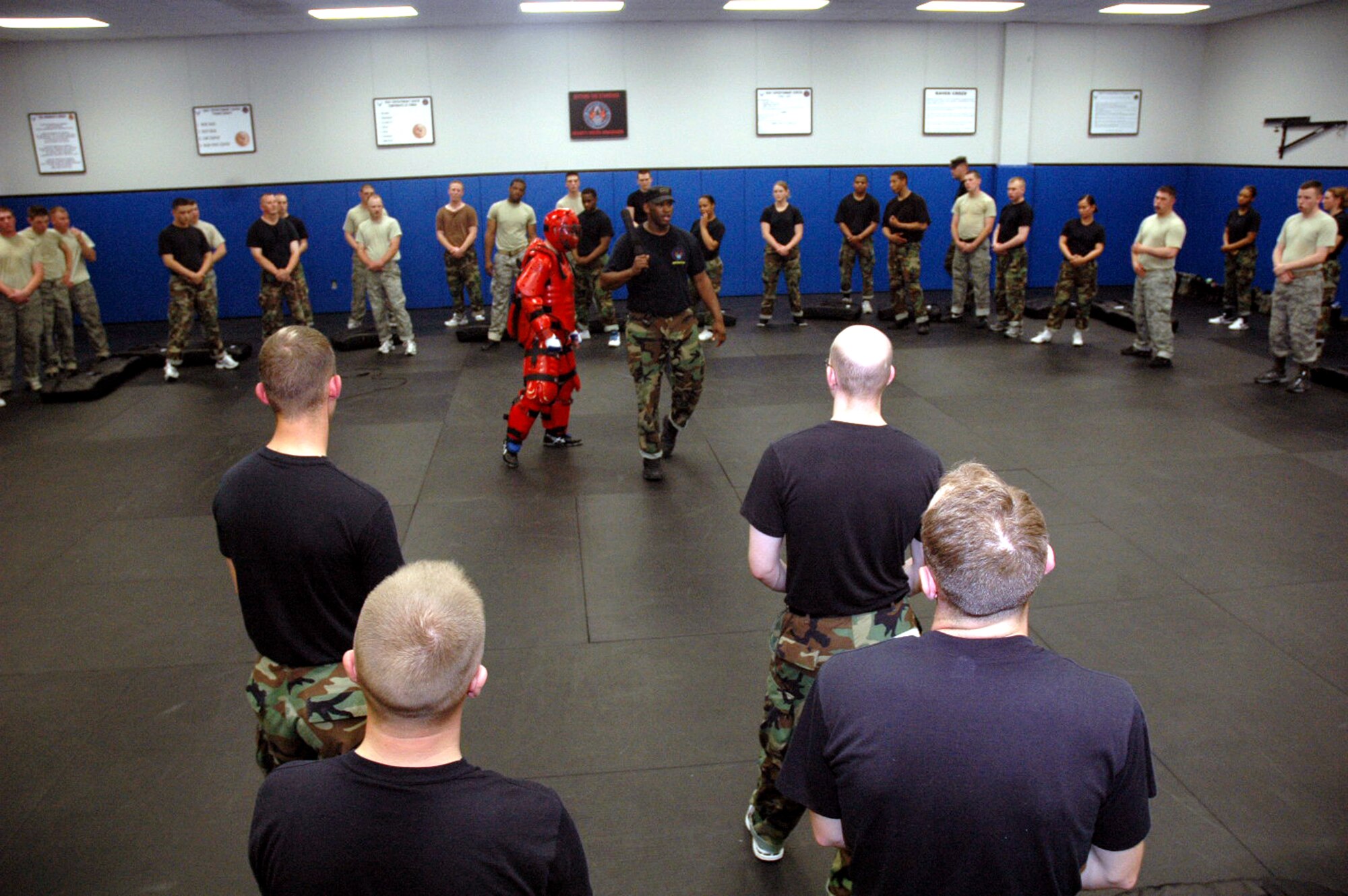 Instructor Staff Sgt. Rudolph Stuart shows students in the Air Force Fly-Away Security Team training course, or FAST, proper response techniques when using an ASP baton as part of the course's training May 12, 2008, at the U.S. Air Force Expeditionary Center on Fort Dix, N.J.  The course is taught by the Center's 421st Combat Training Squadron and teaches security forces Airmen the skills they'll need for fly-away security missions in the U.S. Central Command area of responsibility.  (U.S. Air Force Photo/Tech. Sgt. Scott T. Sturkol)