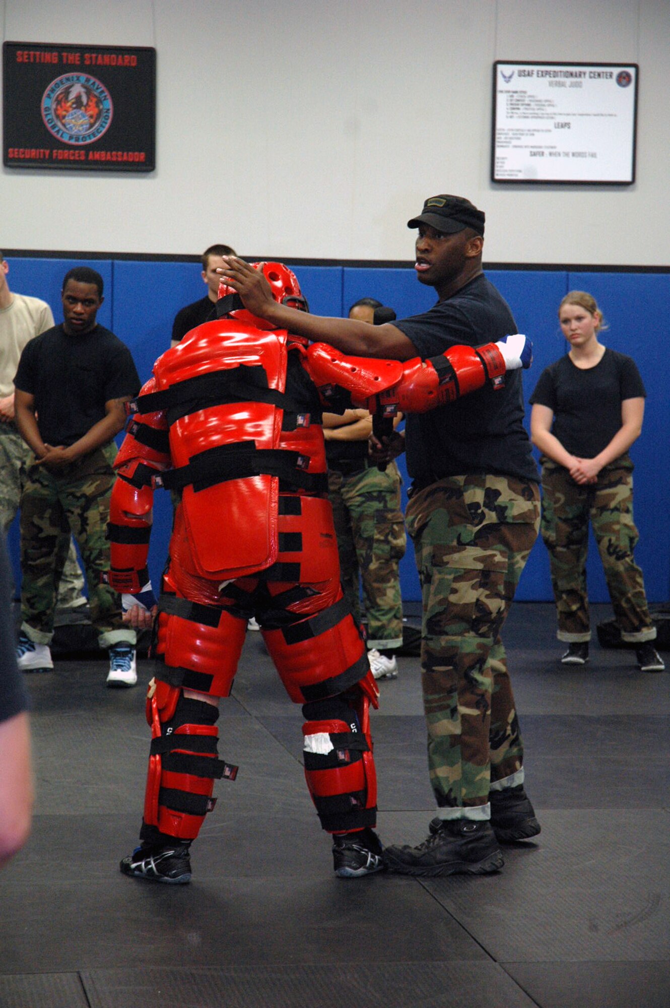 Instructor Staff Sgt. Rudolph Stuart shows students in the Air Force Fly-Away Security Team training course, or FAST, proper response techniques when using an ASP baton as part of the course's training May 12, 2008, at the U.S. Air Force Expeditionary Center on Fort Dix, N.J.  The course is taught by the Center's 421st Combat Training Squadron and teaches security forces Airmen the skills they'll need for fly-away security missions in the U.S. Central Command area of responsibility.  (U.S. Air Force Photo/Tech. Sgt. Scott T. Sturkol)