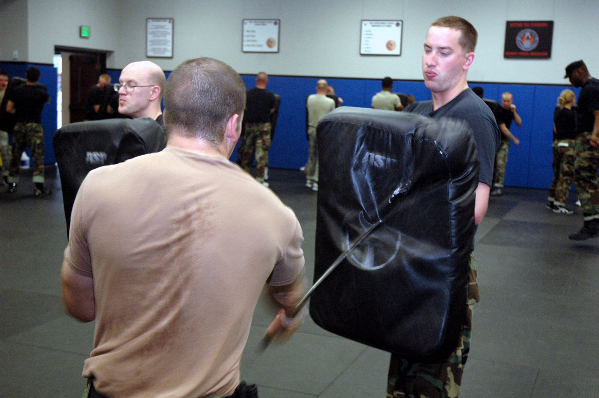 Students in the Air Force Fly-Away Security Team training course, or FAST, practice combatives with an ASP baton as part of the course's training May 12, 2008, at the U.S. Air Force Expeditionary Center on Fort Dix, N.J.  The course is taught by the Center's 421st Combat Training Squadron and teaches security forces Airmen the skills they'll need for fly-away security missions in the U.S. Central Command area of responsibility.  (U.S. Air Force Photo/Tech. Sgt. Scott T. Sturkol)