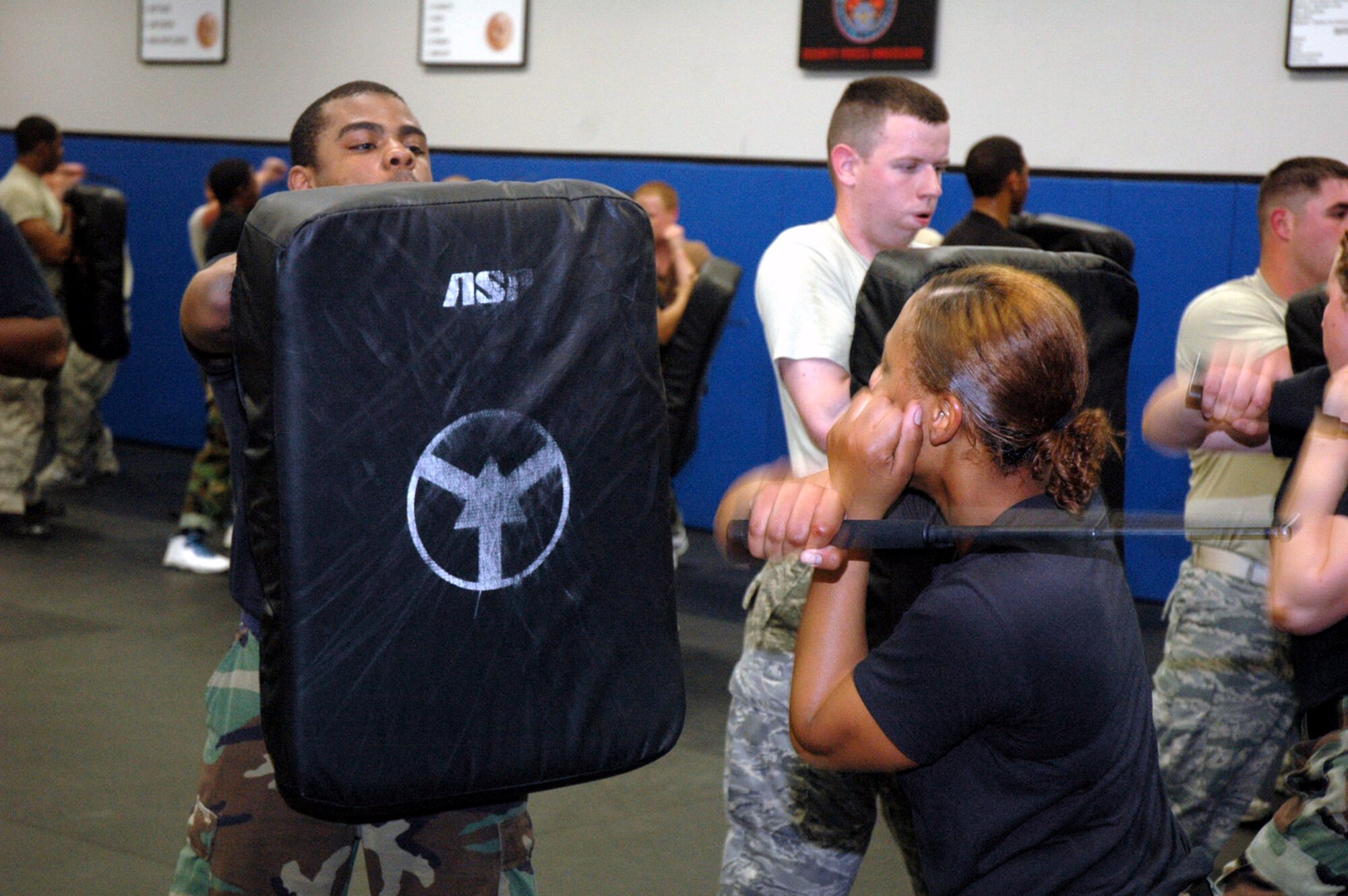 Students in the Air Force Fly-Away Security Team training course, or FAST, practice combatives with an ASP baton as part of the course's training May 12, 2008, at the U.S. Air Force Expeditionary Center on Fort Dix, N.J.  The course is taught by the Center's 421st Combat Training Squadron and teaches security forces Airmen the skills they'll need for fly-away security missions in the U.S. Central Command area of responsibility.  (U.S. Air Force Photo/Tech. Sgt. Scott T. Sturkol)