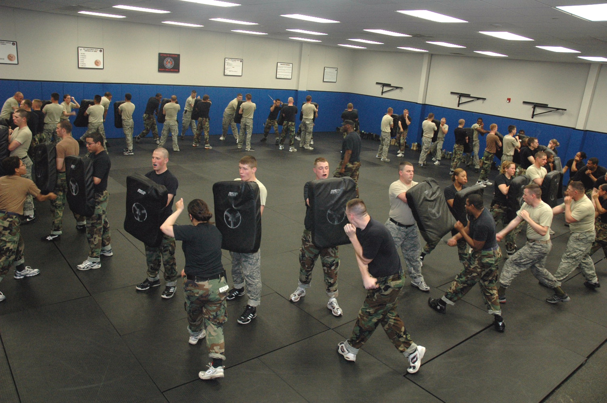 Students in the Air Force Fly-Away Security Team training course, or FAST, practice combatives with an ASP baton as part of the course's training May 12, 2008, at the U.S. Air Force Expeditionary Center on Fort Dix, N.J.  The course is taught by the Center's 421st Combat Training Squadron and teaches security forces Airmen the skills they'll need for fly-away security missions in the U.S. Central Command area of responsibility.  (U.S. Air Force Photo/Tech. Sgt. Scott T. Sturkol)