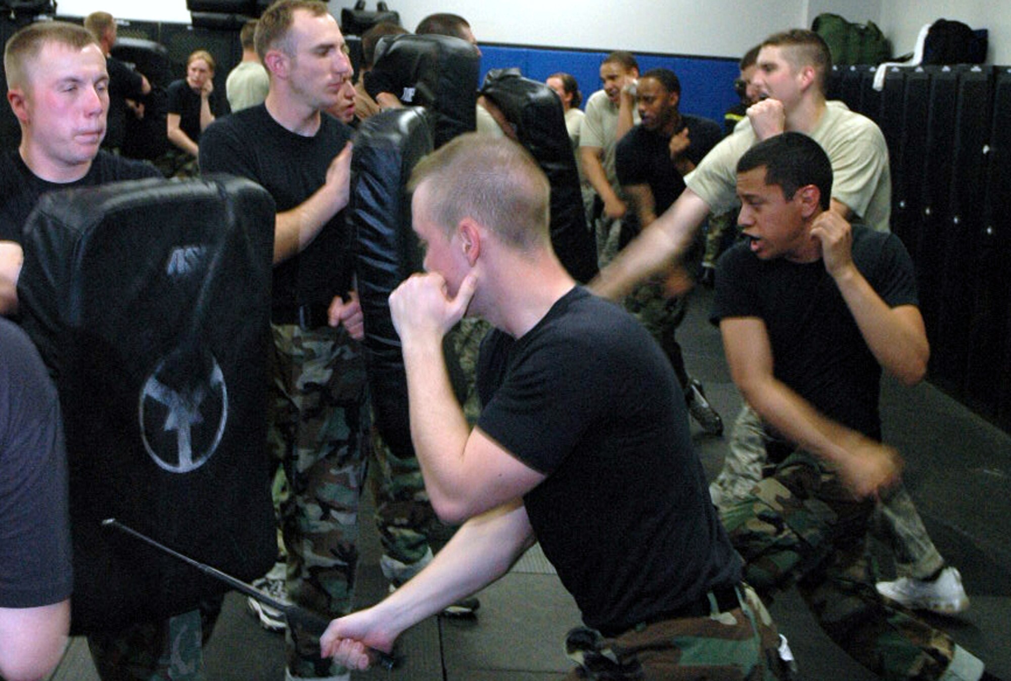 Students in the Air Force Fly-Away Security Team training course, or FAST, practice combatives with an ASP baton as part of the course's training May 12, 2008, at the U.S. Air Force Expeditionary Center on Fort Dix, N.J.  The course is taught by the Center's 421st Combat Training Squadron and teaches security forces Airmen the skills they'll need for fly-away security missions in the U.S. Central Command area of responsibility.  (U.S. Air Force Photo/Tech. Sgt. Scott T. Sturkol)