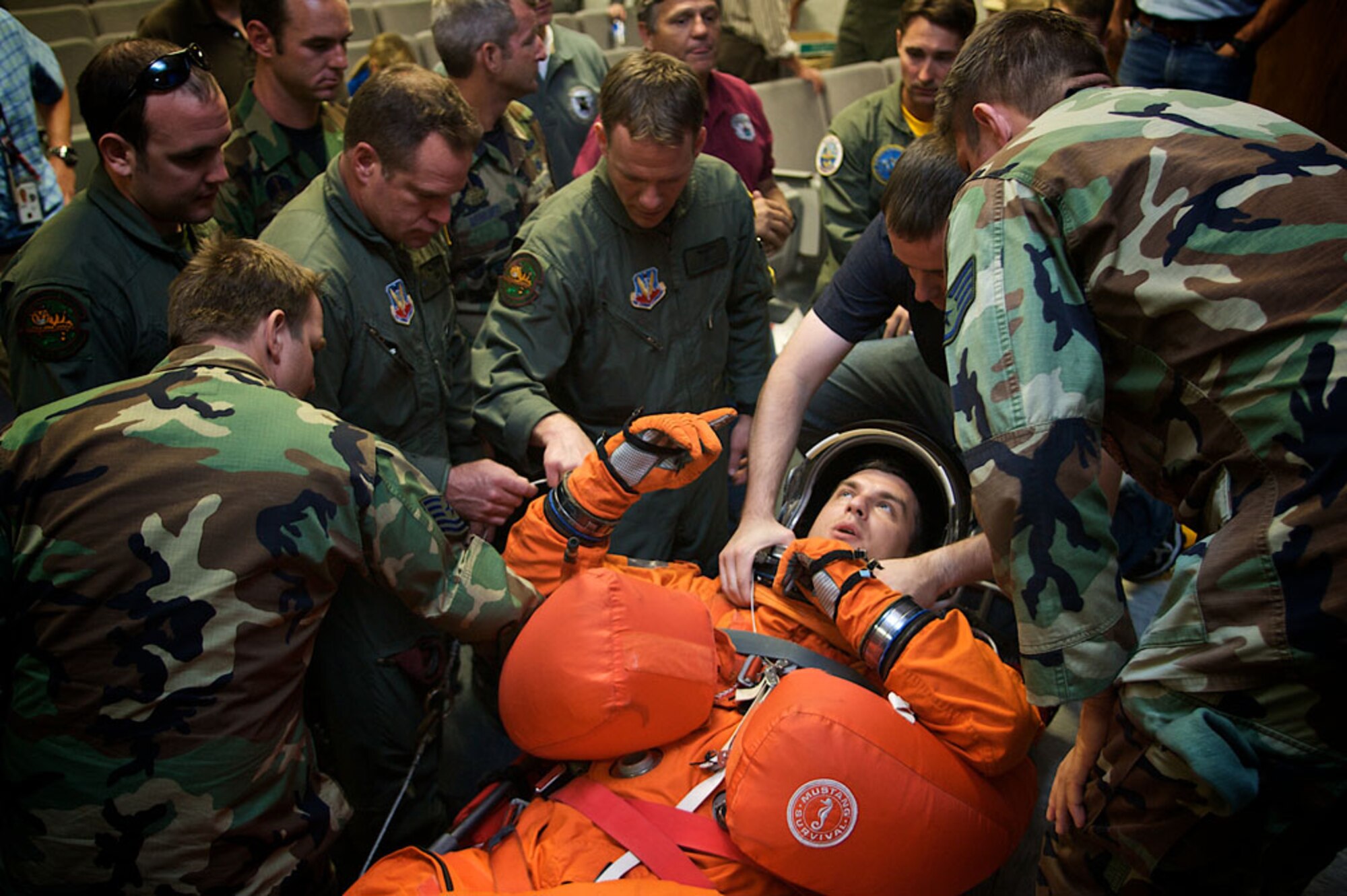 PATRICK AIR FORCE BASE, Fla.  -- Pararescuemen from the 920th Rescue Wing prepare for a "Mode 8" emergency search and rescue exercise by learning about the suits worn by NASA astronauts. The exercise simulated a Mode 8 emergency open water bailout and search and rescue operation. Members of the 920th RQW are part of a joint task force that supports Space Shuttle launches and are always ready in the event of an emergency. (U.S. Air Force photo/Tech. Sgt. Jeremy Allen)