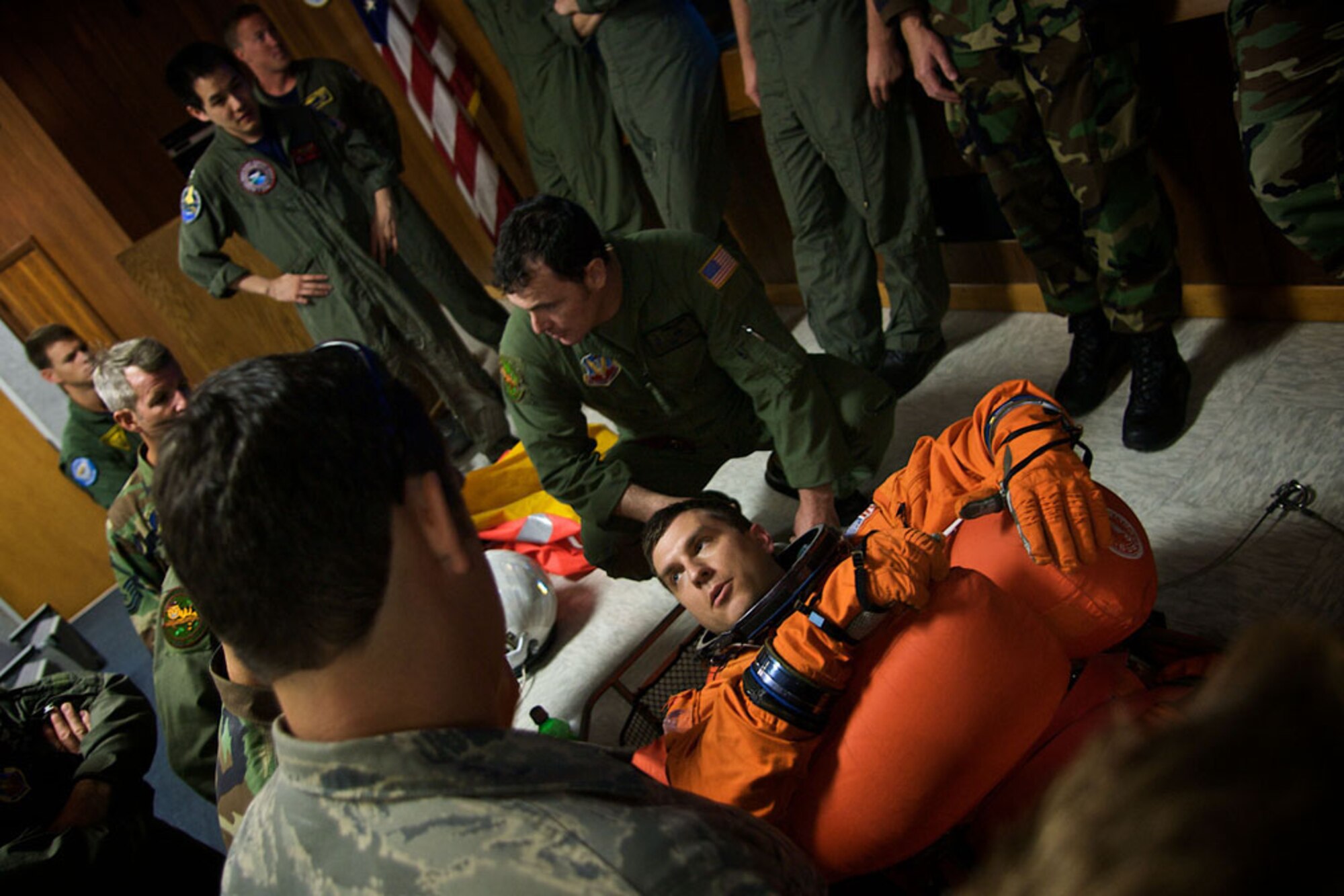 PATRICK AIR FORCE BASE, Fla. -- Pararescuemen from the 920th Rescue Wing conduct a pre-exercise briefing to become acquainted with floatation devices worn by NASA astronauts.  Members of the 920th RQW, along with a number of other military units, are participants in a Mode 8 emergency Space Shuttle astronaut bailout search and rescue exercise off the Florida coast.  Pararescuemen and crews from the 920th RQW support every Space Shuttle launch as part of a joint task force in case an emergency occurs. (U.S. Air Force photo/Tech. Sgt. Jeremy Allen)