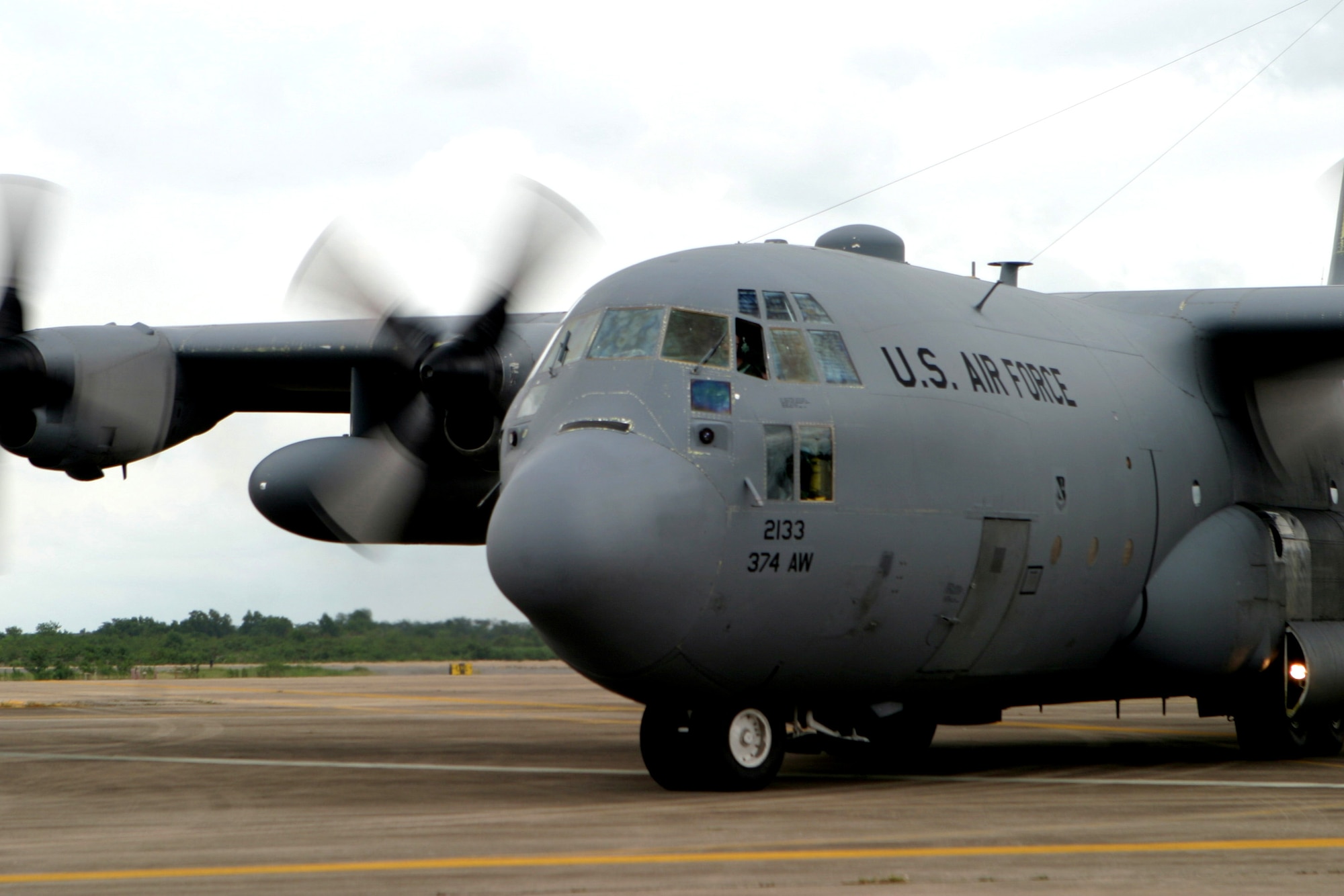 A C-130 Hercules loaded with humanitarian supplies takes off from Utapao Thai Royal Navy Air Base in Thailand to deliver relief supplies to victims of Cyclone Nargis in Burma. The Air Force is part of the Joint Task Force Caring Response, a multi-service Humanitarian Assistance and Disaster Relief effort for Burmese citizens devastated by the recent cyclone. (U.S. Marine Corps photo/Lance Cpl. Robert A. Harding)