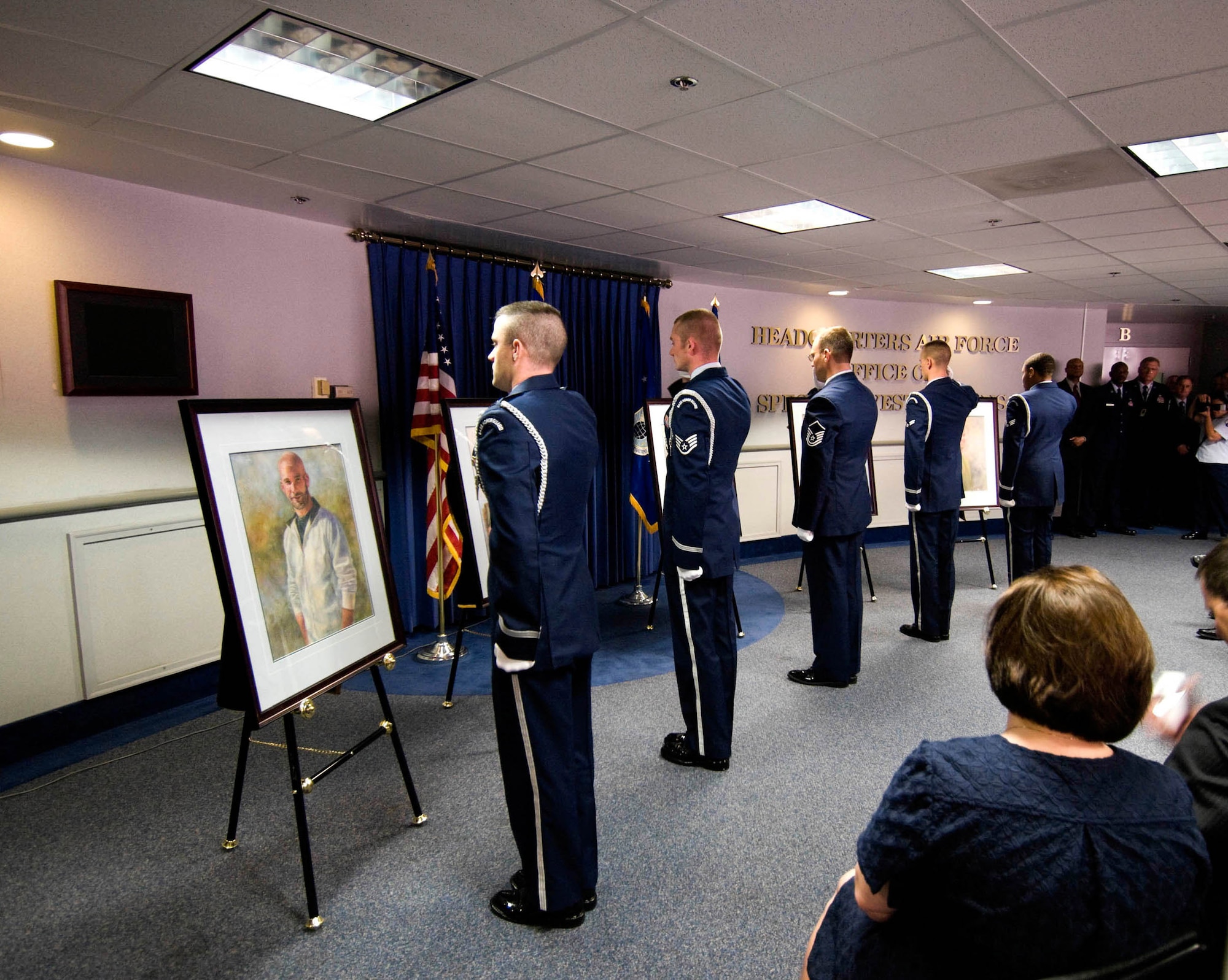 Portraits of Special Agents David Wieger, Nathan Schuldheiss, Thomas Crowell, Matthew Kuglics and Ryan Balmer are unveiled at the AFOSI Rotunda by the Andrews Air Force Base Honor Guard. (U.S. Air Force photo/Mike Hastings) 