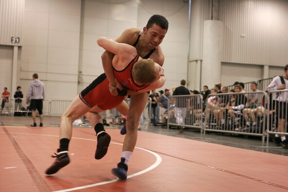 LAS VEGAS-- Air Force wrestler Airman 1st Class Andrew Perez (blue) throws his opponent, Paul Tellgreen, Minnesota Storm wrestling club, out of bounds in round-three competition of the senior men’s Greco tournament, 55 kilos, during the 2008 U.S. National Wrestling Championships April 25 at the Las Vegas Convention Center. Airman Perez placed 8th in his weight class, assisting the Air Force team in taking home three overall place wins. (U.S. Air Force photo/Staff Sgt. Jacob R. McCarthy)