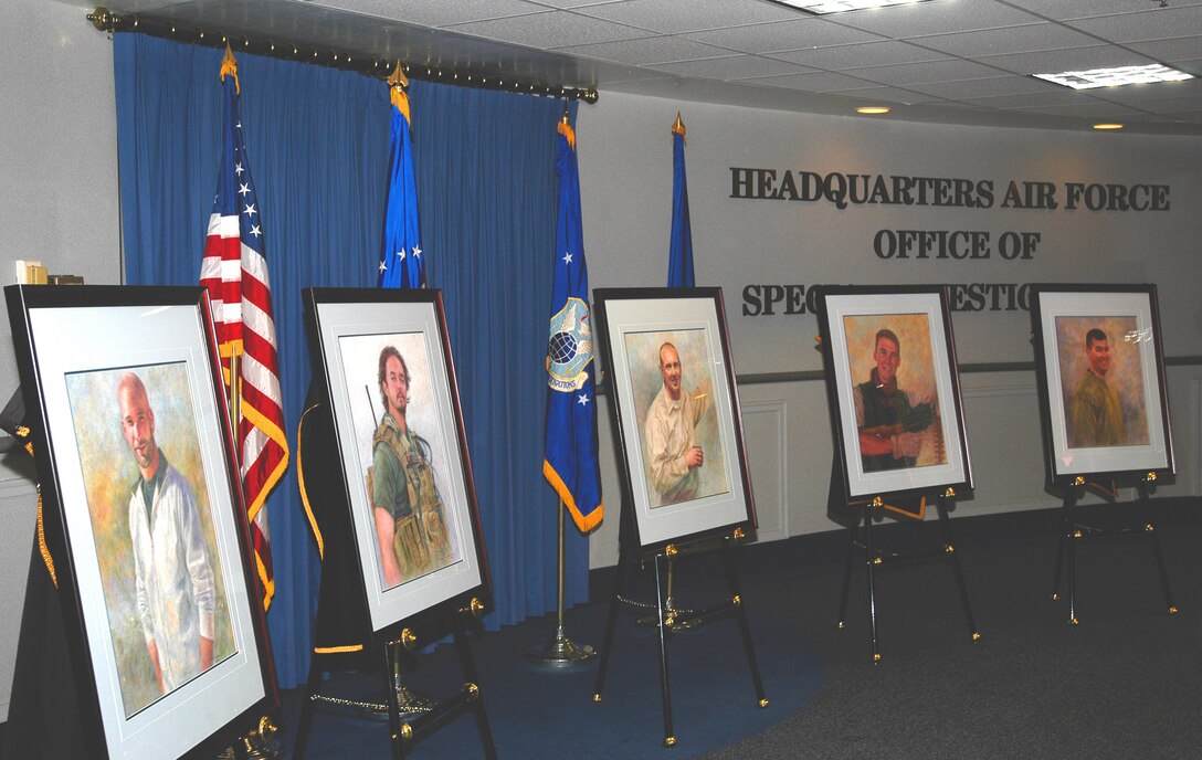 Portraits of Special Agents (l to r) David Wieger, Nathan Schuldheiss, Thomas Crowell,  Matthew Kuglics and Ryan Balmer are unveiled at the AFOSI Rotunda (U.S. Air Force photo/Tech. Sgt. John Jung)