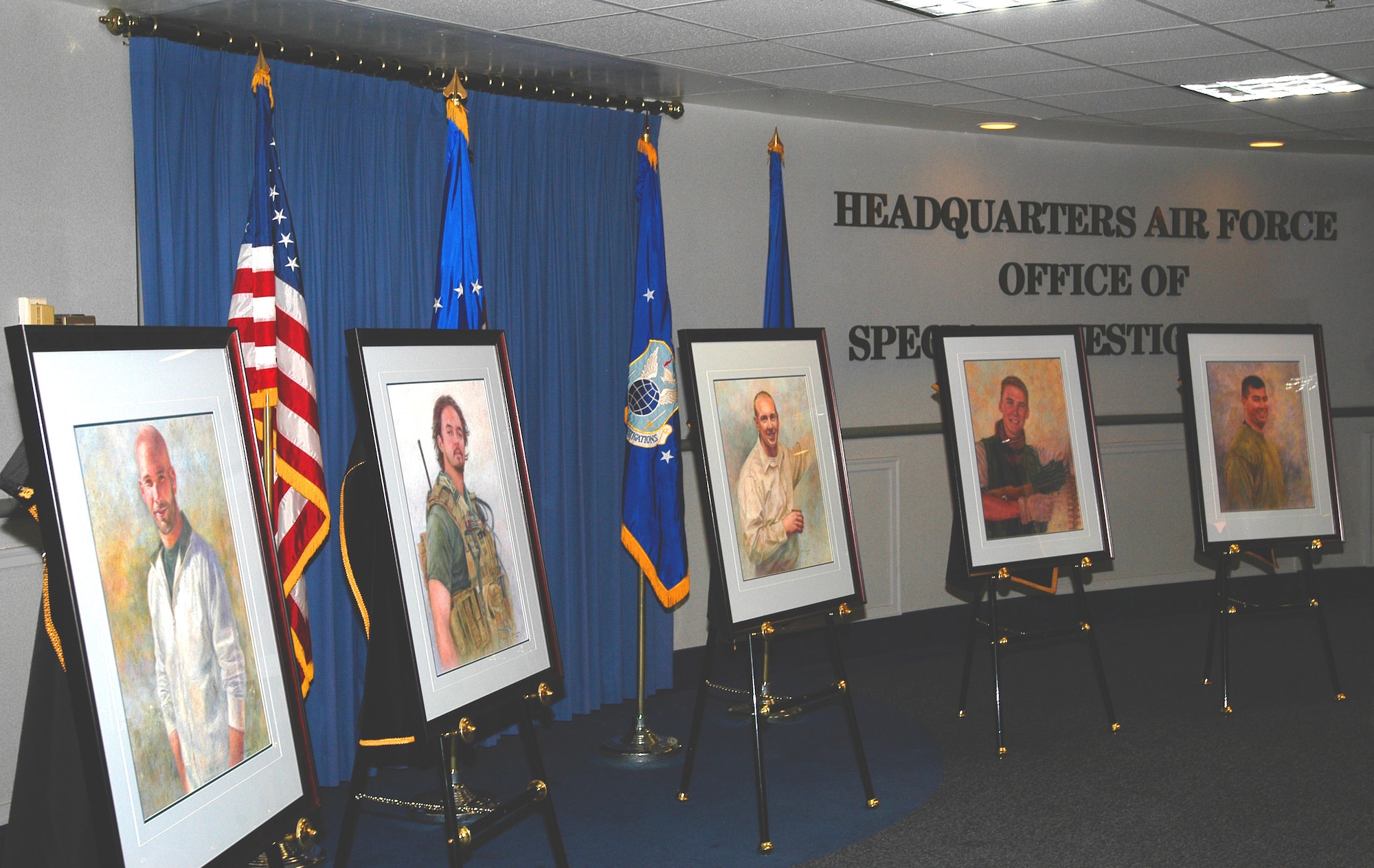 Portraits of Special Agents (l to r) David Wieger, Nathan Schuldheiss, Thomas Crowell,  Matthew Kuglics and Ryan Balmer are unveiled at the AFOSI Rotunda (U.S. Air Force photo/Tech. Sgt. John Jung)