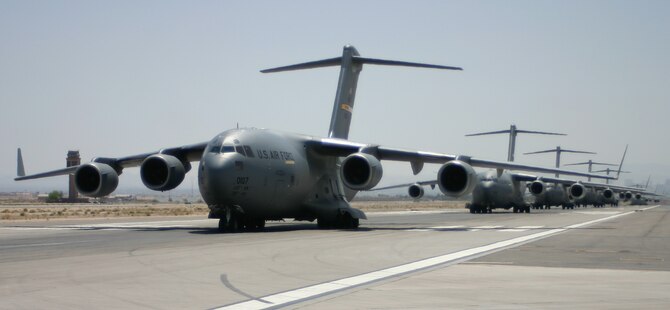 C-17s line the flightline for an Elephant Walk at Nellis Air Force Base, Nev., May 9 following the 57th Weapons Squadron's Mobility Air Forces Exercise. (U.S. Air Force photo/Senior Airman Danielle Johnson)
