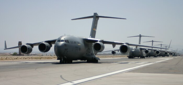 C-17s line the flightline for an Elephant Walk at Nellis Air Force Base, Nev., May 9 following the 57th Weapons Squadron's Mobility Air Forces Exercise. (U.S. Air Force photo/Senior Airman Danielle Johnson)