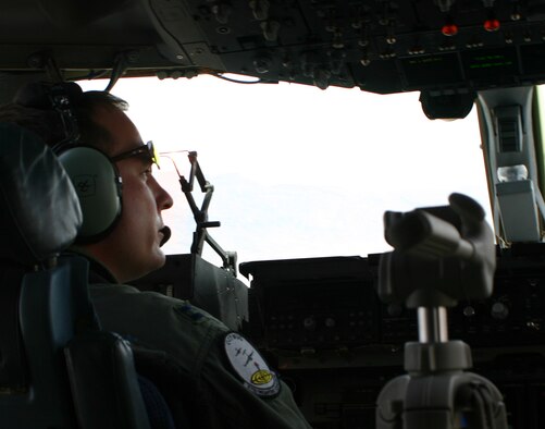 Capt. Harold Cramer, 57th Weapons School student and Mobility Air Force Exercise mission commander, scans the skies after being "attacked" during a simulated airdrop at the Nevada Test and Training Range May 9. (U.S. Air Force photo/Senior Airman Danielle Johnson)