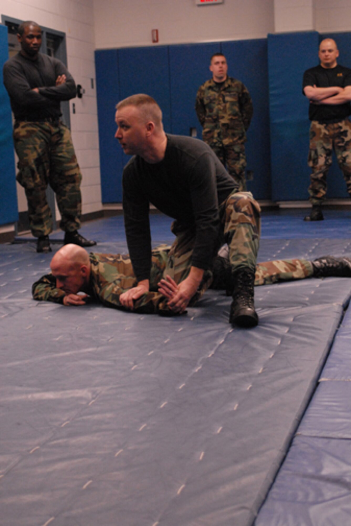 Master Sergeant Robert York and Master Sergeant Dean Butler demonstrate self defense tactical moves for a class on anti-terrorism  with the Security Police from 180th Fighter Wing Air National Guard from Swanton, Ohio at the campus of Owens State Community College in Toledo, Ohio on April 13, 2008.  Air Force Photo by Senior Airman Jodi L. Joice. (Released)  