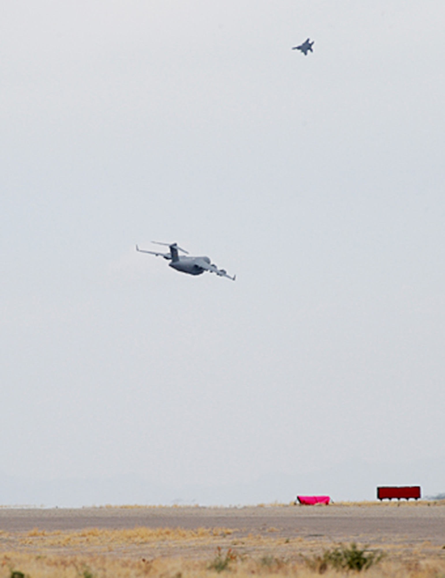 Nearly 40 aircraft from bases around the country participated in the 57th Weapons Squadron's Mobility Air Forces Exercise over the Nevada Test and Training Range May 9. The exercise scenario involved simulated airdrops of cargo and personnel, airland operations, aerial refuelings, and combat support provided by A-10s, F-15Es and F-16s. (U.S. Air Force photo)