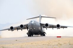 Nearly 40 aircraft from bases around the country participated in the 57th Weapons Squadron's Mobility Air Forces Exercise over the Nevada Test and Training Range May 9. The exercise scenario involved simulated airdrops of cargo and personnel, airland operations, aerial refuelings, and combat support provided by A-10s, F-15Es and F-16s. (U.S. Air Force photo)