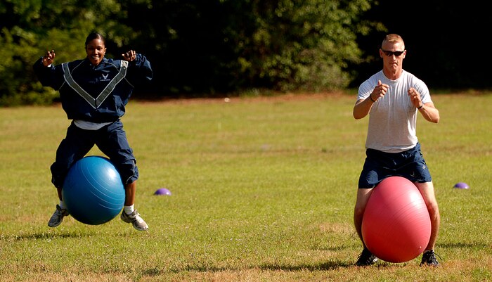 Sandquiette Simmons and Phillip King race during the "Guns N' Hoses" fitness challenge at the Charleston AFB picnic grounds May 12. The "Guns N' Hoses" challenge was a competition between the 437th Security Forces Squadron and the 437th Civil Engineer Squadron fire department to kick off National Police Week. The fire department won the challenge. Simmons and King are both with the 437 SFS.  (U.S. Air Force photo/Senior Airman Nicholas Pilch)