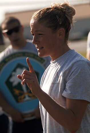 Meghan Donahue explains the rules for the "Guns N' Hoses" fitness challenge at the Charleston AFB picnic grounds May 12.   Donahue is with the 437 SFS. (U.S. Air Force photo/Senior Airman Nicholas Pilch)